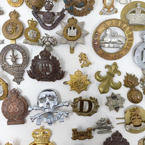 985 - Assorted military cap and other badges