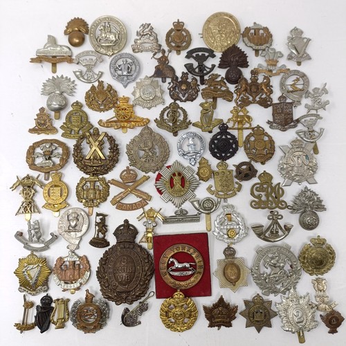 987 - Assorted military cap and other badges