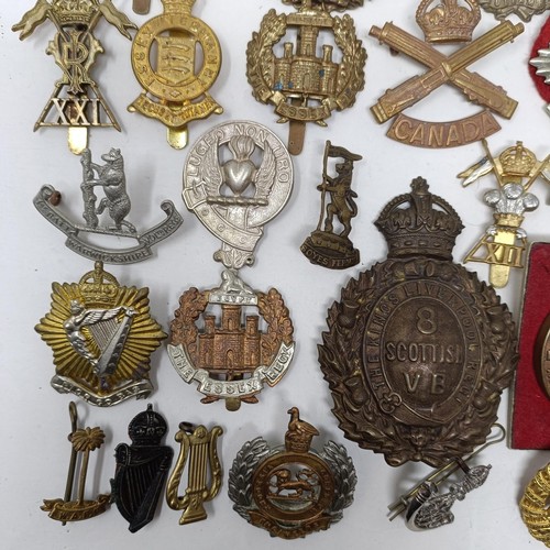 987 - Assorted military cap and other badges