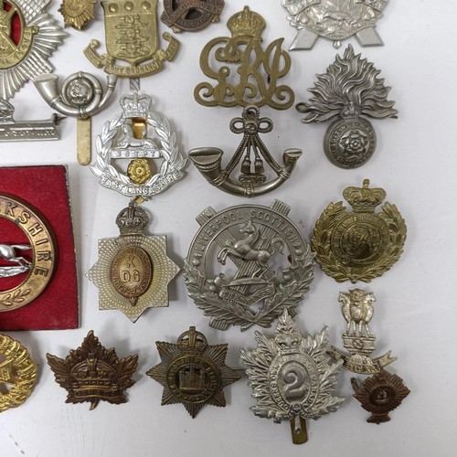 987 - Assorted military cap and other badges