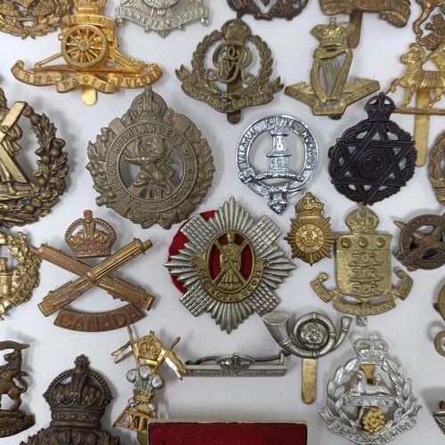 987 - Assorted military cap and other badges