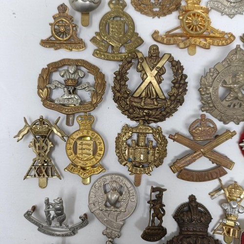 987 - Assorted military cap and other badges