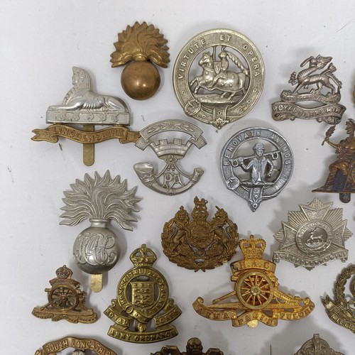 987 - Assorted military cap and other badges