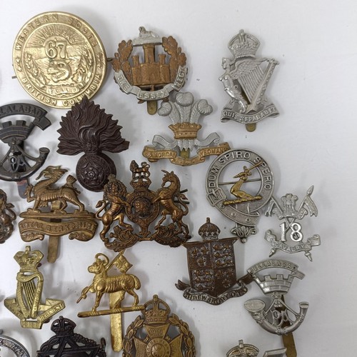 987 - Assorted military cap and other badges