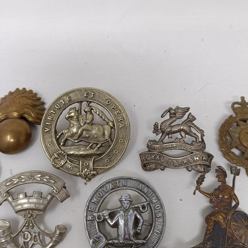 987 - Assorted military cap and other badges