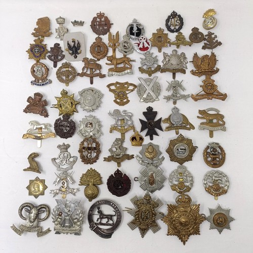 990 - Assorted military cap and other badges