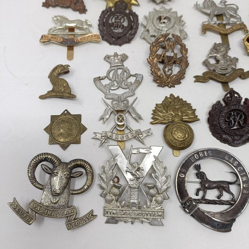 990 - Assorted military cap and other badges