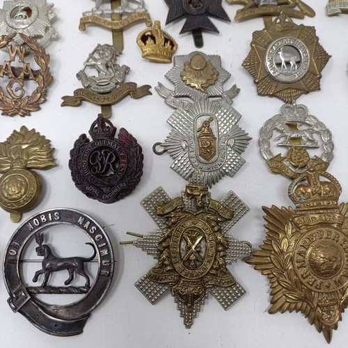 990 - Assorted military cap and other badges