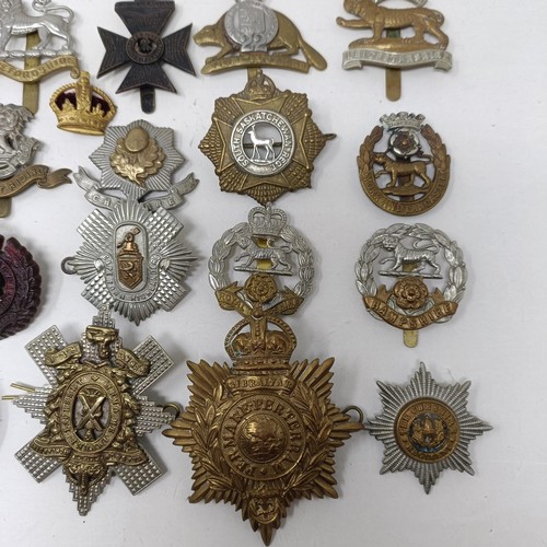 990 - Assorted military cap and other badges