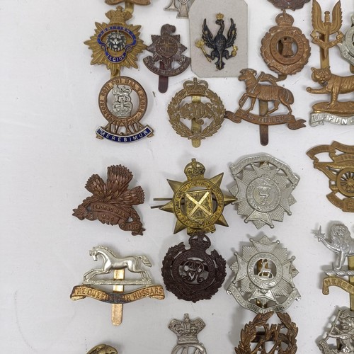 990 - Assorted military cap and other badges