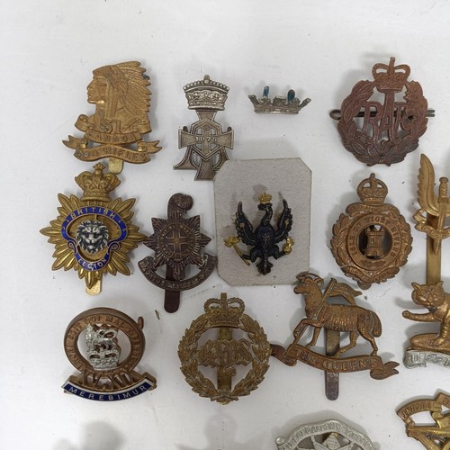 990 - Assorted military cap and other badges