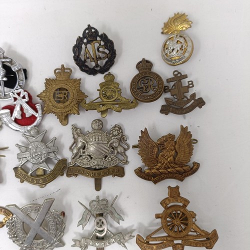 990 - Assorted military cap and other badges