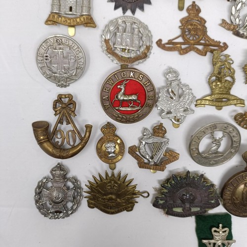 991 - Assorted military cap and other badges