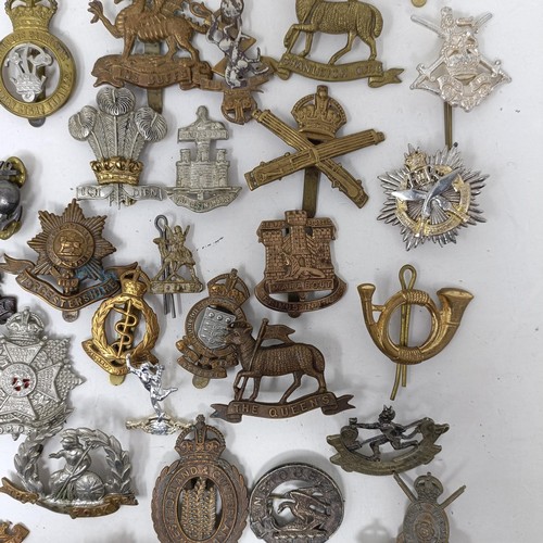 991 - Assorted military cap and other badges