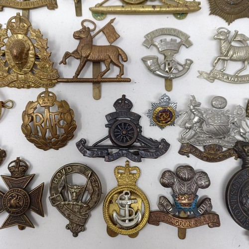 992 - Assorted military cap and other badges