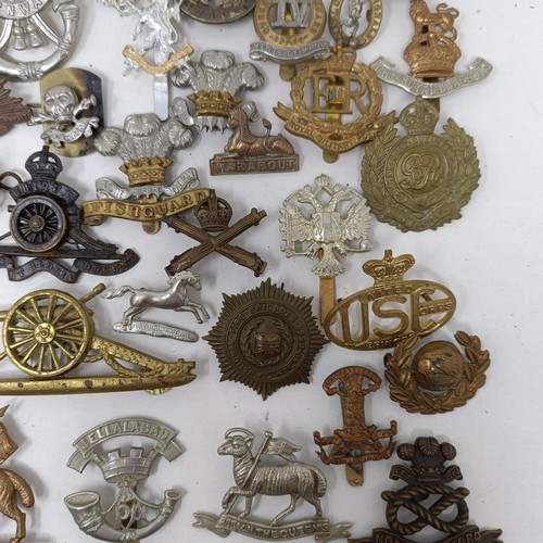 992 - Assorted military cap and other badges