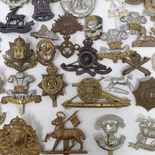 992 - Assorted military cap and other badges