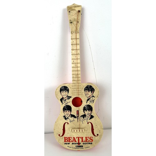 587 - A Beatles New Sound plastic guitar, by Selcol