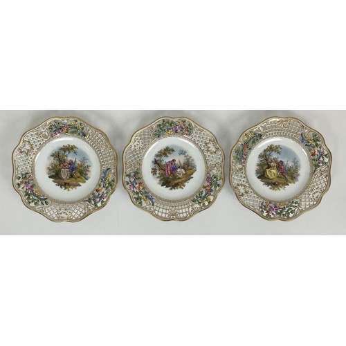 1310 - A Dresden part dessert service, with a pierced border, the centres decorated with figures (qty)