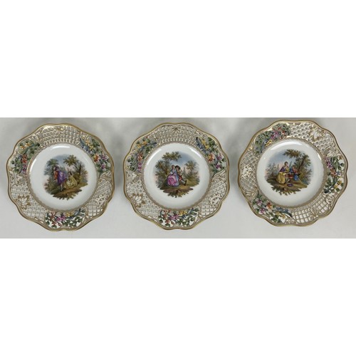 1310 - A Dresden part dessert service, with a pierced border, the centres decorated with figures (qty)