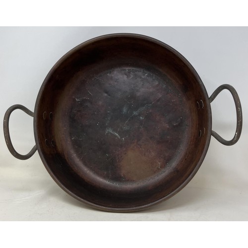 1312 - A bow Port Pattern copper lamp, 45 cm high, a preserve pan, a measure, and an oval picture frame, wi... 