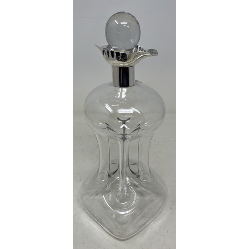 1315 - A George V glass decanter, with a silver mount, 29 cm high