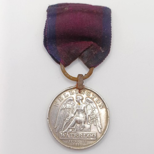 950A - A George III Waterloo Medal, awarded to William Reynolds 51st Reg Light Infantry, with a steel ring ... 