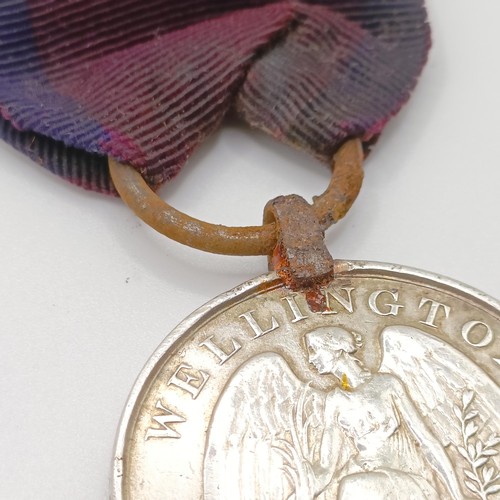 950A - A George III Waterloo Medal, awarded to William Reynolds 51st Reg Light Infantry, with a steel ring ... 