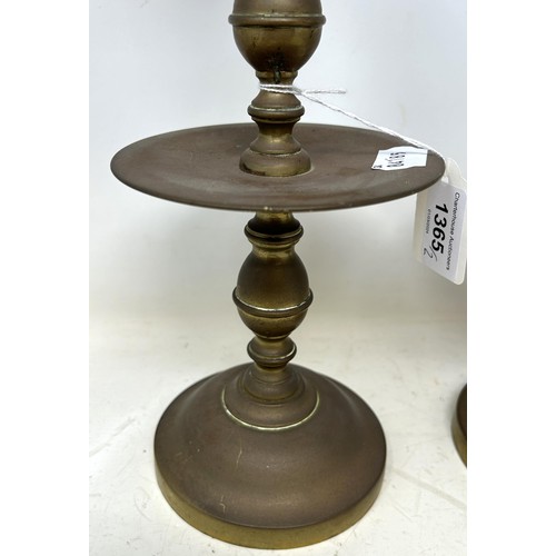 1365 - A pair of Dutch 17th century style brass candlesticks, with wide drip pans, 30 cm high (2)