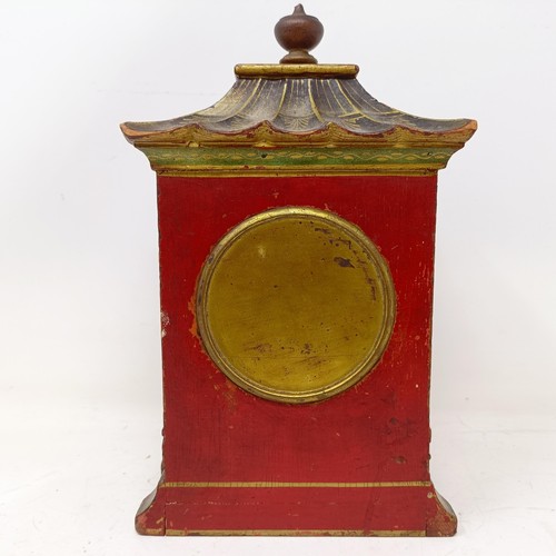 1506 - A mantel clock, with Arabic numerals, in a red case with Chinoiserie style decoration, 26 cm high