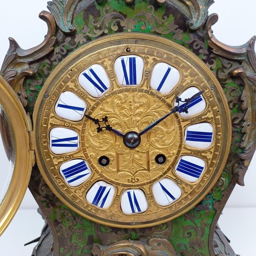 1511 - A Louis XV style mantel clock, the 13.5 cm diameter gilt metal dial with enamel numerals, fitted an ... 