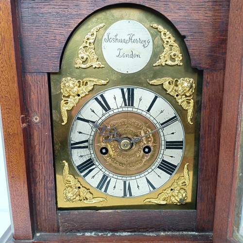 1513 - An 18th century style bracket clock, the arched brass dial signed Joshua Herring, London, with a sil... 