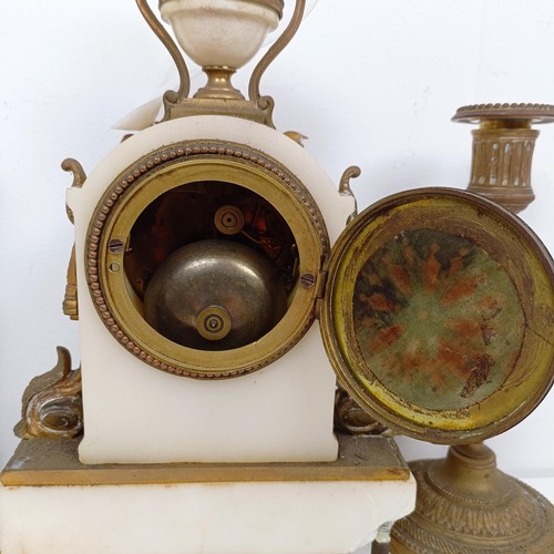 1520 - A late 19th century clock garniture, the clock having a 7 cm diameter enamel dial, with Roman numera... 