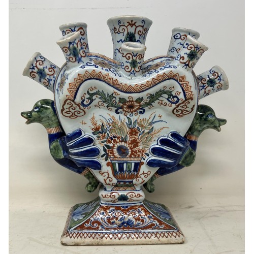 1328 - A 19th century Delft pottery tulip vase, with polychrome decoration and bird handles, 21.5 cm high