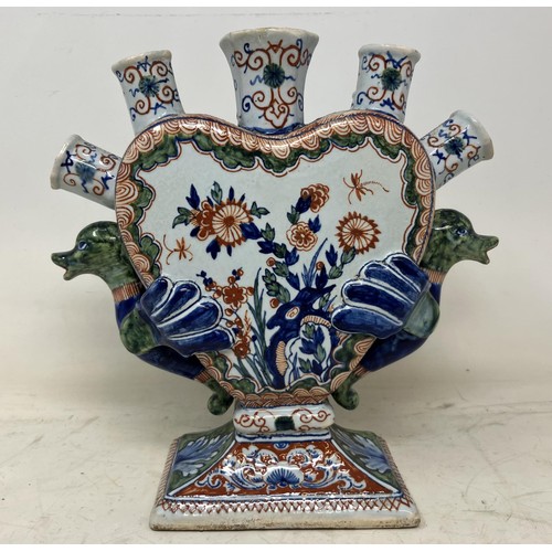 1328 - A 19th century Delft pottery tulip vase, with polychrome decoration and bird handles, 21.5 cm high