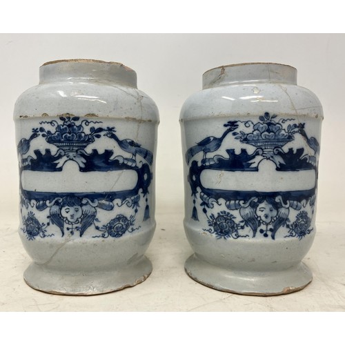 1330 - A pair of 19th century Delft pottery jug jars, with a vacant cartouche, repaired/restored, 14 cm hig... 