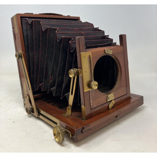 1332 - A Thornton Pickard mahogany plate camera, with assorted plates (qty)