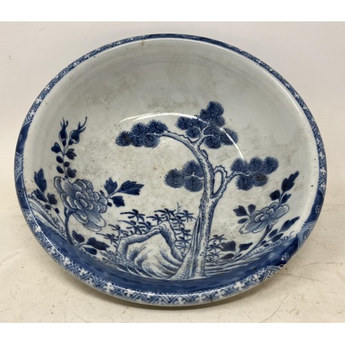 1333 - A Japanese pottery bowl, decorated foliage in underglaze blue, possibly 17th century, 27.5 cm diamet... 