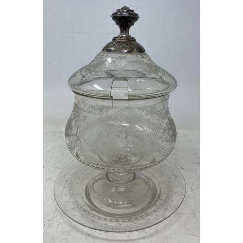 1335 - An etched glass bowl, cover, stand and ladle, with silver coloured metal mounts, 28 cm high (2)