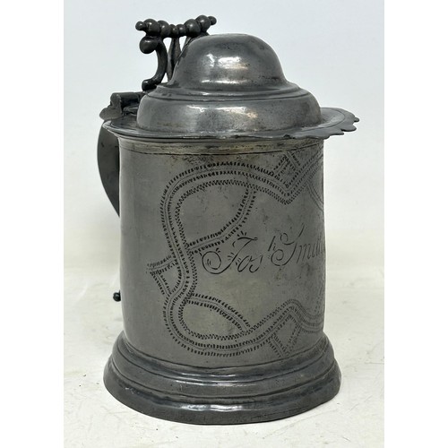 1339 - A 19th century pewter lidded tankard, inscribed Josh Smith, and with wrigglework decoration, 18 cm h... 