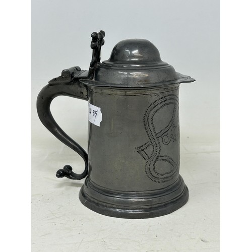 1339 - A 19th century pewter lidded tankard, inscribed Josh Smith, and with wrigglework decoration, 18 cm h... 