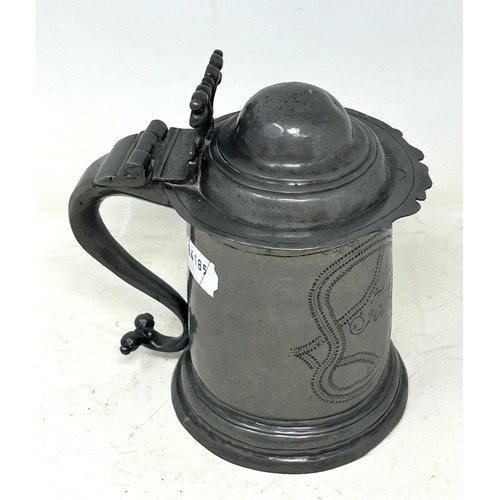 1339 - A 19th century pewter lidded tankard, inscribed Josh Smith, and with wrigglework decoration, 18 cm h... 