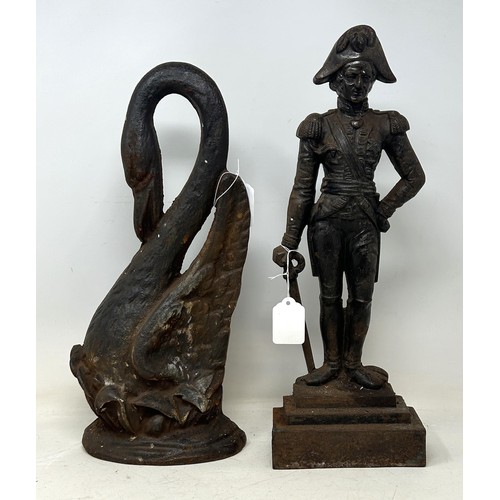 1346 - A late 19th century cast iron doorstop, in the form of a swan, 38 cm high, and another (2)