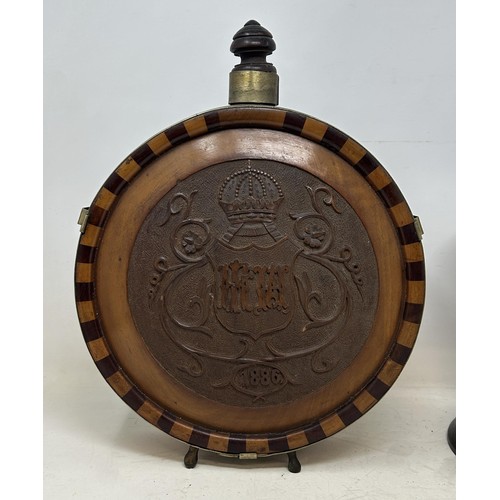 1347 - A late 19th century Dutch treen flask, initialled and dated 1886, 33 cm high, and with a turned wood... 