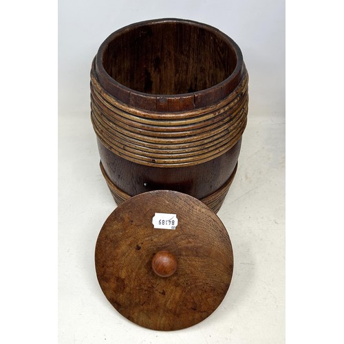 1348 - A late 19th century barrel and cover, 28 cm high, and another similar, 31 cm high (2)