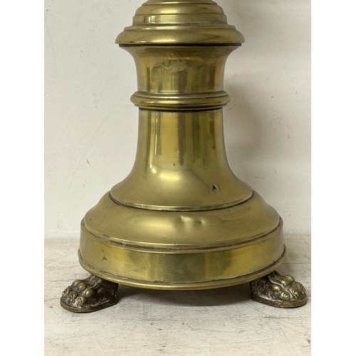 1349 - A large 18th century style brass floor standing pricket stick, on lion paw feet, 96 cm high