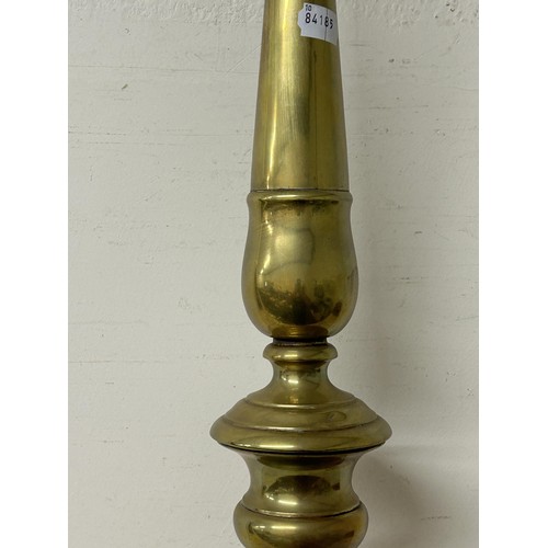 1349 - A large 18th century style brass floor standing pricket stick, on lion paw feet, 96 cm high