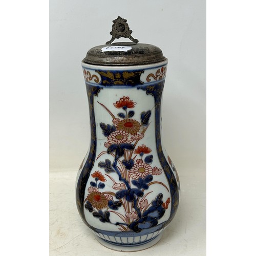 1371 - A Chinese pottery jug, with enamel decoration, 24.5 cm high, a Japanese Imari jug, with silver colou... 