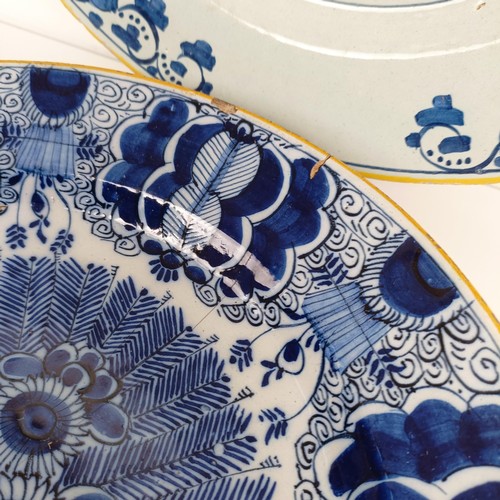 1407 - A pair of blue and white Delft dishes, 36 cm diameter, and assorted other Delft (9)