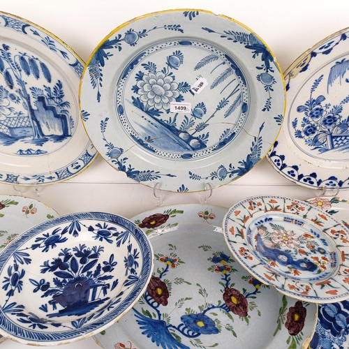 1409 - A Delft blue and white plate, 35 cm diameter, and assorted other Delft plates (12)